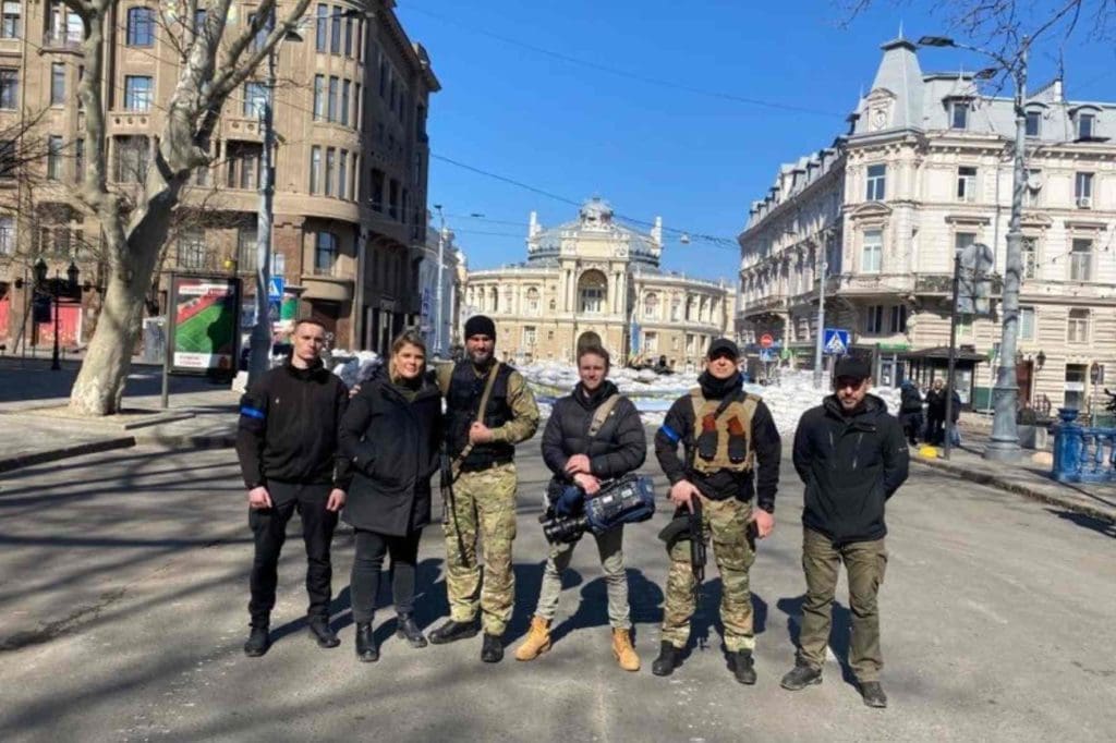 Journalist Lisette Reymer in the Ukraine, with her security team, standing in the street