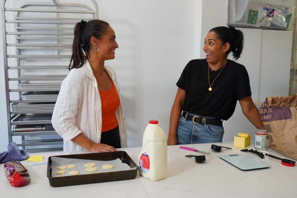 Shenine Dube and Grace Tauber in the middle of their Snack Masters challenge